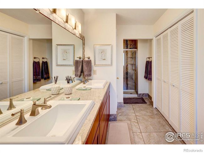 Double sinks and a wall of closets | Image 18