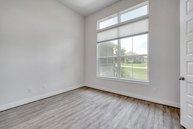 Empty room featuring wood finished floors and baseboards | Image 14