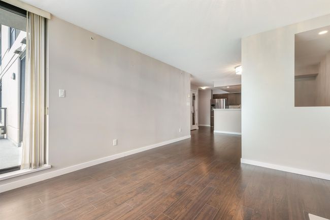 Unfurnished living room with wood finished floors and baseboards | Image 6