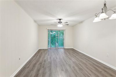 Living room with exterior view & dinning area | Image 2