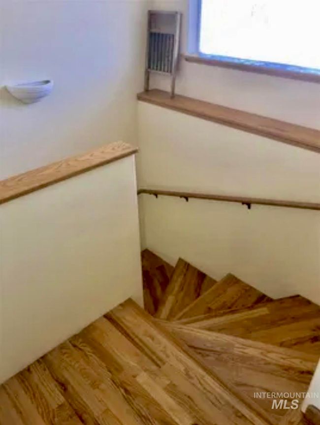 Stairway featuring hardwood finished floors | Image 27