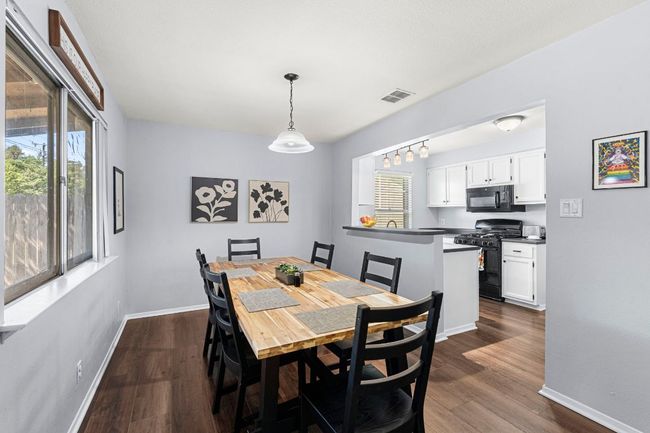 Dining room featuring baseboards and dark wood finished floors | Image 11