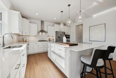 (Photo of a decorated model, actual homes finishes will vary) Such a stunning kitchen layout. | Image 3