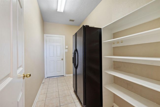 This utility room is huge! Make the most of your Costco runs and fill a second fridge and more storage shelves! | Image 18