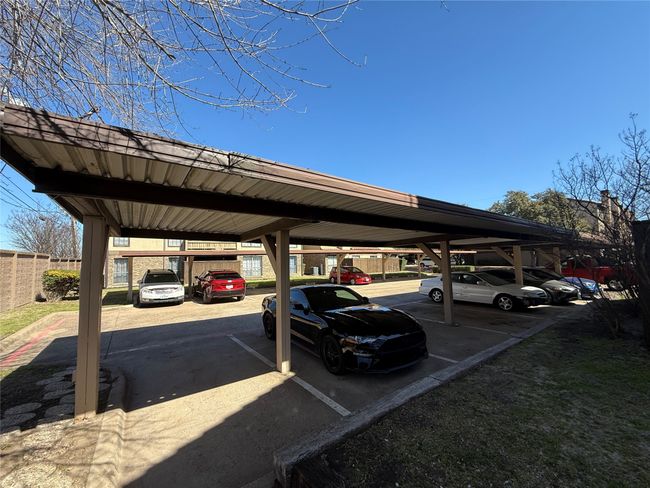 Covered parking lot with fence | Image 17