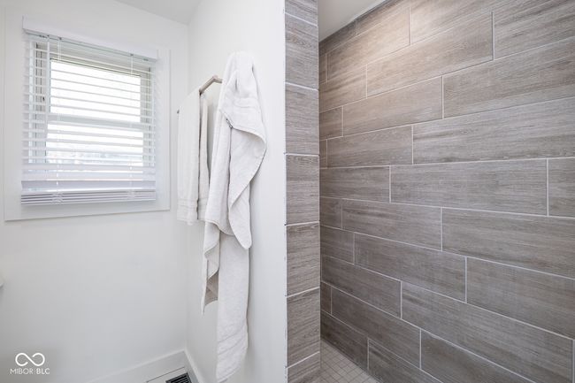full bath with tiled shower | Image 21