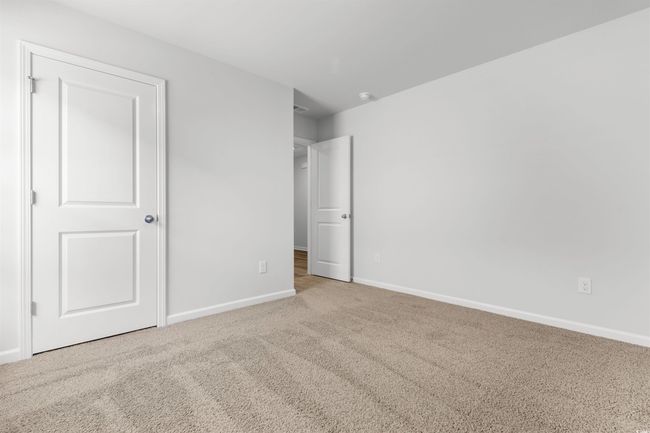 Unfurnished bedroom featuring carpet flooring | Image 5