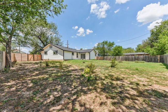 View of fenced backyard | Image 33