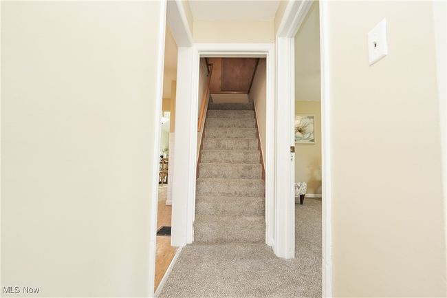 Staircase with baseboards and carpet flooring | Image 27
