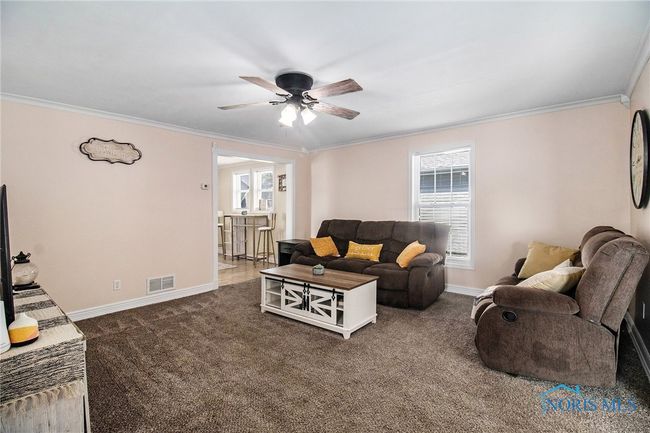 Step into a bright and welcoming living room filled with natural light | Image 8