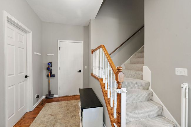 Back stairway from 2nd level to back hallway into | Image 17