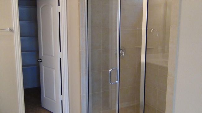 Bathroom featuring a stall shower | Image 13