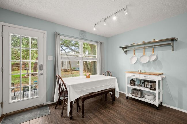The breakfast area is a cozy spot where mornings feel relaxed, with plenty of natural light and space to enjoy a casual meal or sip your coffee while taking in the day | Image 15