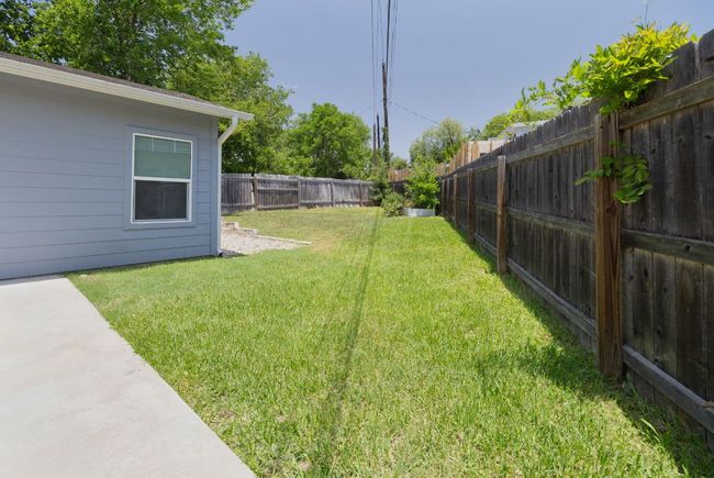 View of fenced backyard | Image 35