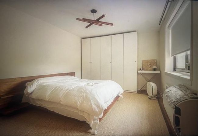 Carpeted bedroom with ceiling fan | Image 18