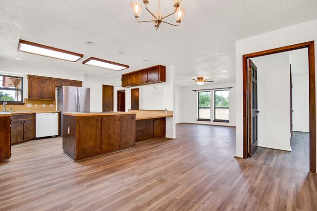 Looking from the dining room to the living room and primary bedroom. | Image 14