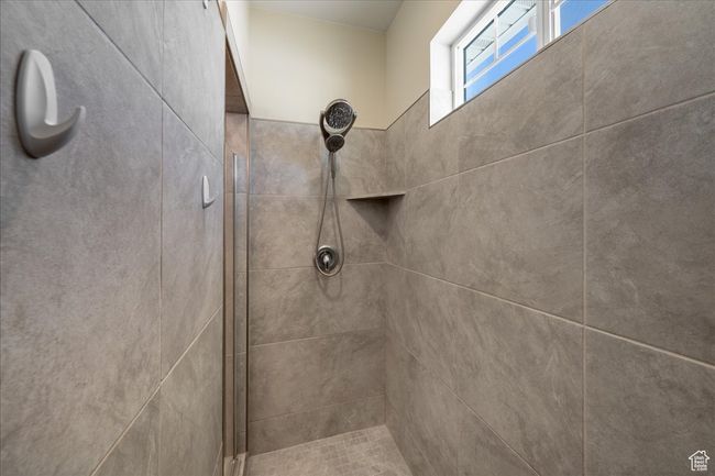 Bathroom with a tile shower | Image 28