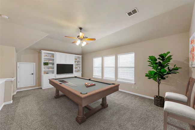 Bonus room featuring vaulted ceiling, carpet, a ceiling fan, and baseboards | Image 29