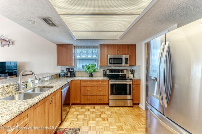 Kitchen Remodeled in 2017 with Contemporary Cabinets, Granite Counters & Stainless Steel Appliances | Image 26