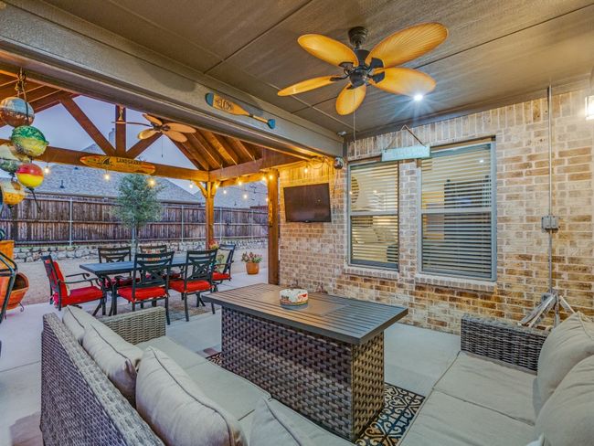View of patio featuring an outdoor living space, a gazebo, and ceiling fan | Image 6