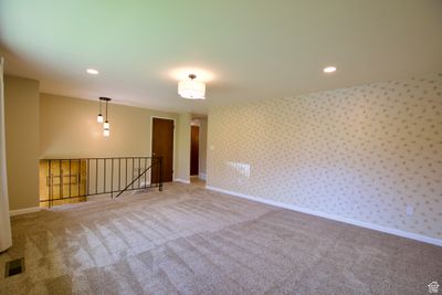 View of carpeted spare room | Image 2