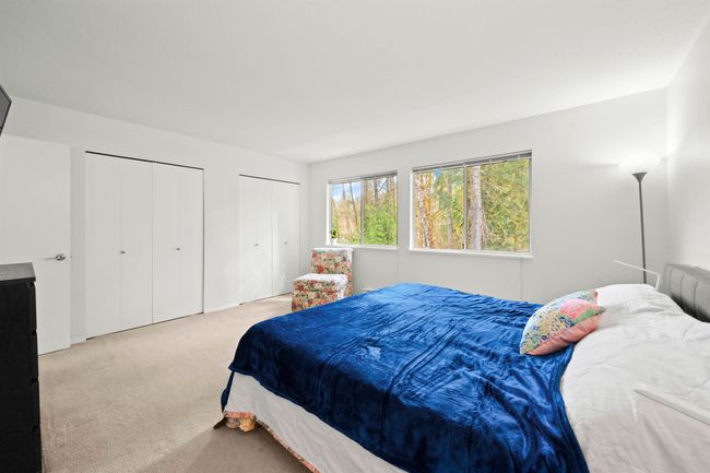 Bedroom featuring carpet and multiple closets | Image 21