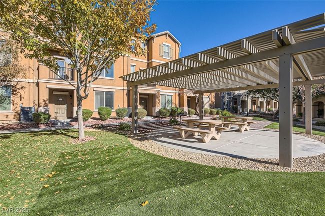 View of community with a lawn and a pergola | Image 11