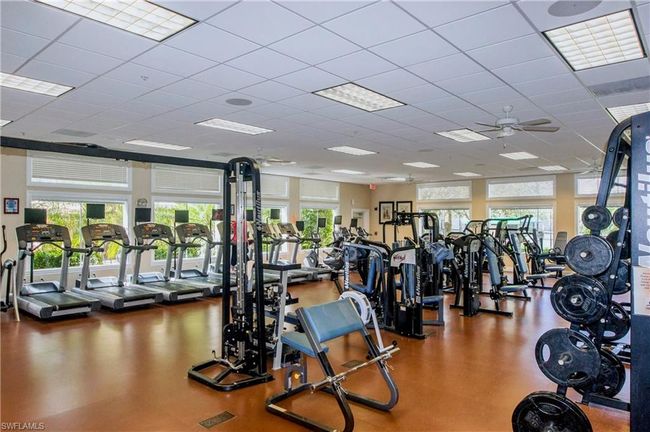 Gym featuring a paneled ceiling and ceiling fan | Image 23