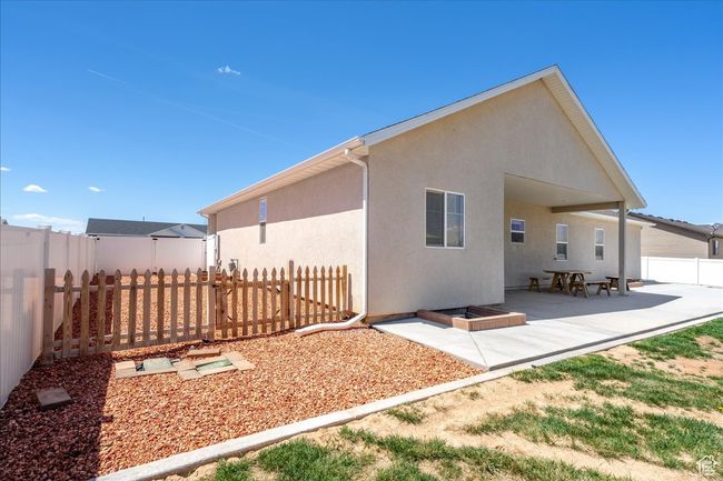 Back of house featuring a patio area, a fenced backyard, and stucco siding | Image 57