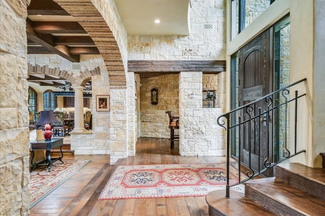 Entryway featuring stairs, decorative columns, and hardwood / wood-style flooring | Image 6