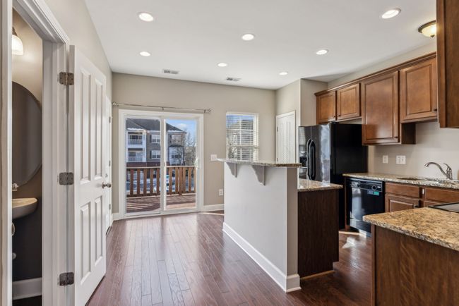 Kitchen has eye-candy granite and is equipped with appliances. | Image 20