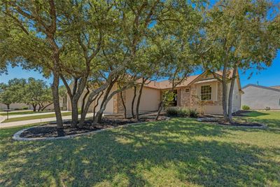 Large Corner Lot on the Golf Course. Mature trees and easy to maintain landscaping! | Image 1