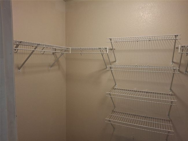 View of spacious closet | Image 13