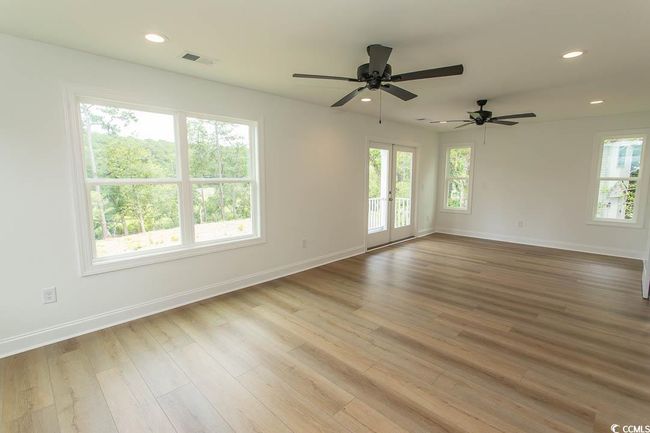 Unfurnished room with baseboards, wood finished floors, ceiling fan, and recessed lighting | Image 21
