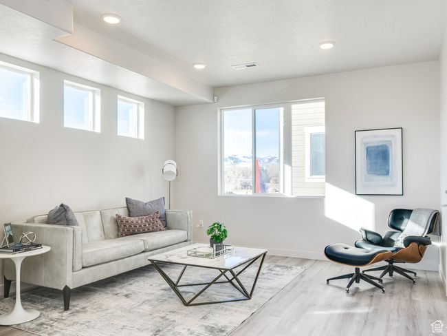 Living area featuring wood finished floors, baseboards, and recessed lighting | Image 4