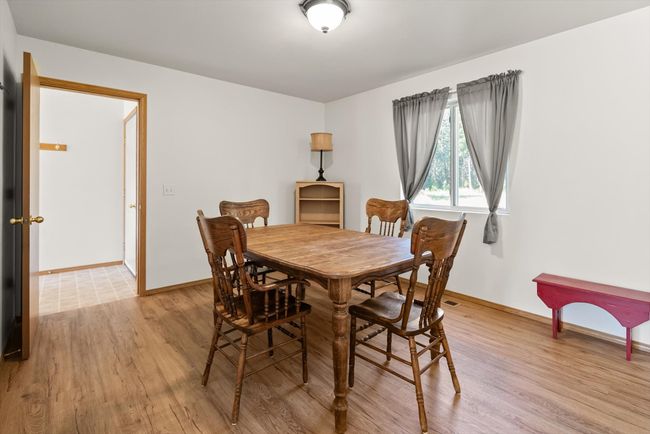Dining area with light wood-type flooring and baseboards | Image 14