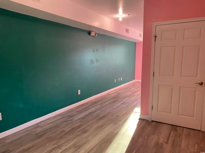 Unfurnished room featuring wood-type flooring | Image 2