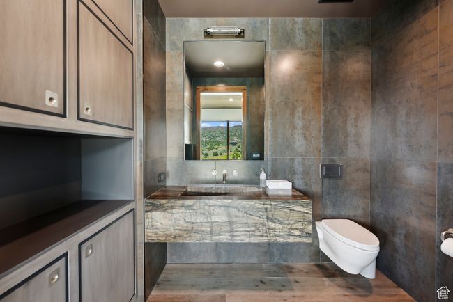 Bathroom featuring toilet and a bath | Image 111