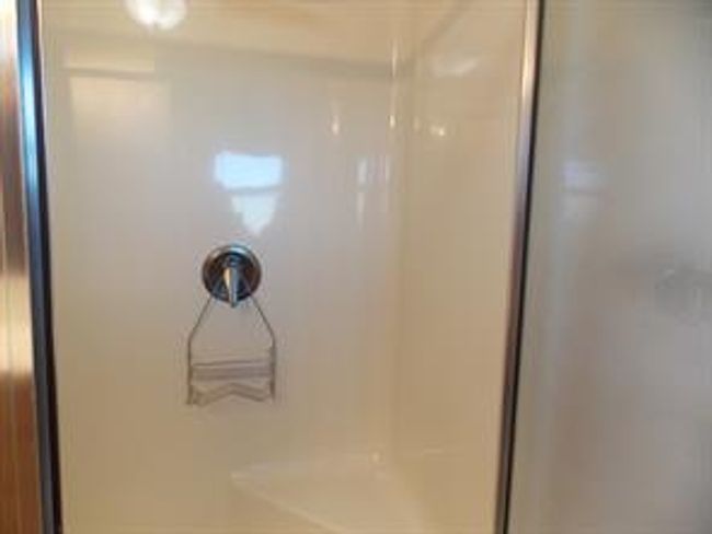 77 - 5210 65 Ave, Home with 3 bedrooms, 2 bathrooms and 3 parking in Olds AB | Image 25