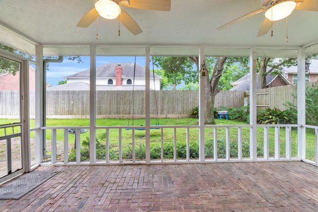 View from the back door of the porch, brick pavers for flooring. | Image 37