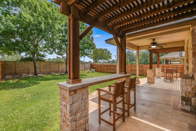 View of patio with ceiling fan | Image 30