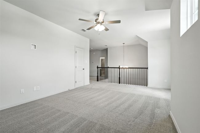 Spare room featuring a ceiling fan and carpet floors | Image 30