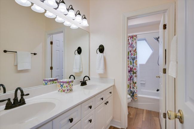 The guest bathroom is conveniently located near the secondary bedrooms for easy access. | Image 18