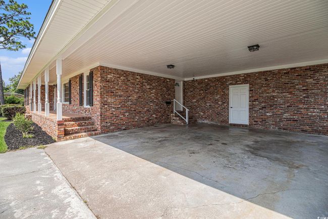 Oversized Attached 2-Car Carport with Workshop/Utility Room | Image 5