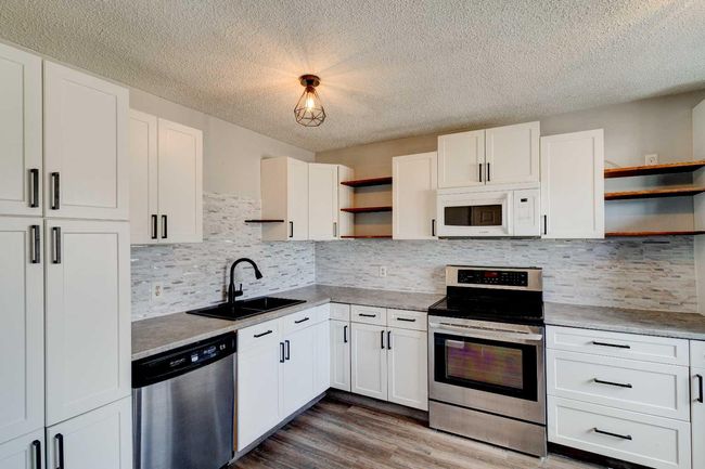 7812 Cedarwood Park, Home with 3 bedrooms, 1 bathrooms and 2 parking in Grande Prairie AB | Image 2