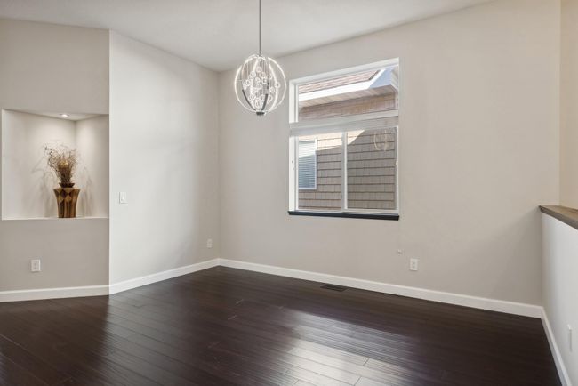 Another view of the dining room space. Be sure to notice the led lighted display niche feature. Perfect for that special art or conversation piece to be admired! | Image 18