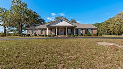 1st Pond with Cookhouse and Manicured Landscaping | Image 2