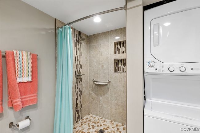 Full bath with stacked washer / dryer, a stall shower, and recessed lighting | Image 13