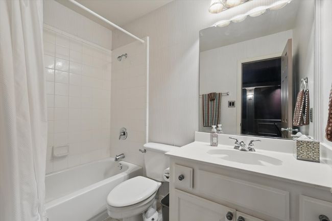 Full bath with toilet, shower / bath combo, and vanity | Image 22