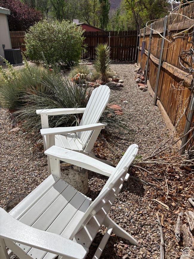 Fenced backyard with central AC | Image 50